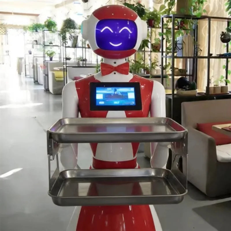 Robot camarero con bandeja metálica doble y pantalla azul en la cara, cuerpo rojo y blanco