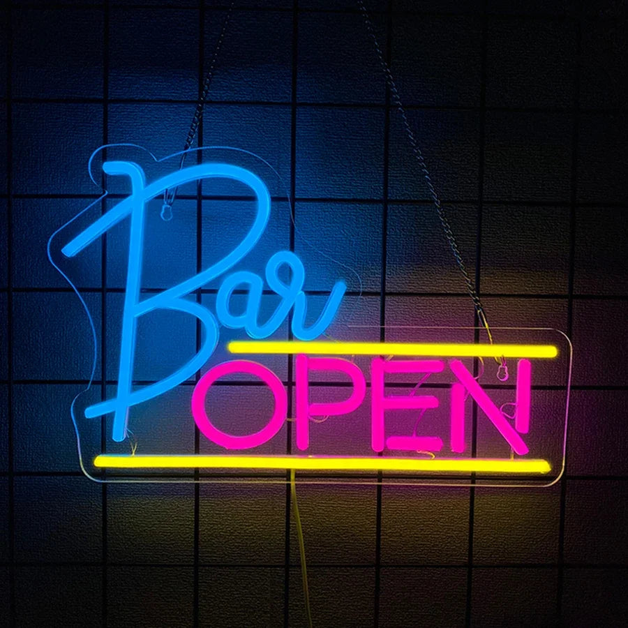 Letrero neón BAR OPEN con copa azul y letras OPEN en magenta
