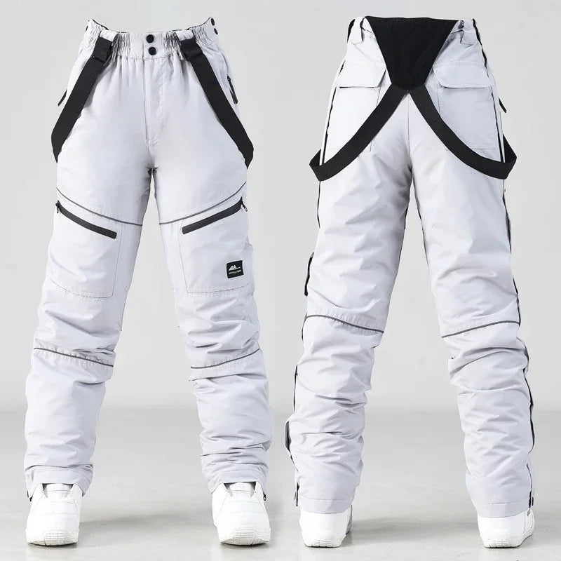 2024 deporte al aire libre hombre pantalones de esquí a prueba de viento mujeres pantalones de nieve montaña algodón Snowboard monos femeninos ropa impermeable