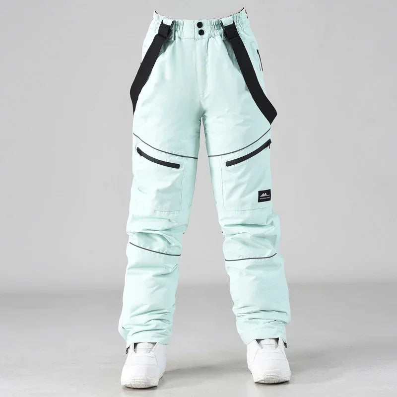 2024 deporte al aire libre hombre pantalones de esquí a prueba de viento mujeres pantalones de nieve montaña algodón Snowboard monos femeninos ropa impermeable