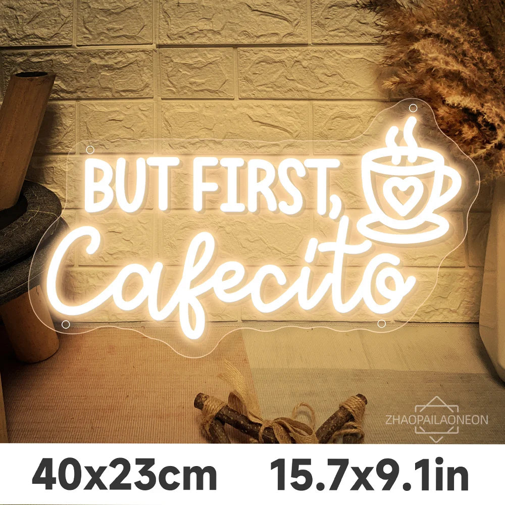 Letrero LED de neón «But first, Cafecito»; taza con corazón en blanco y amarillo