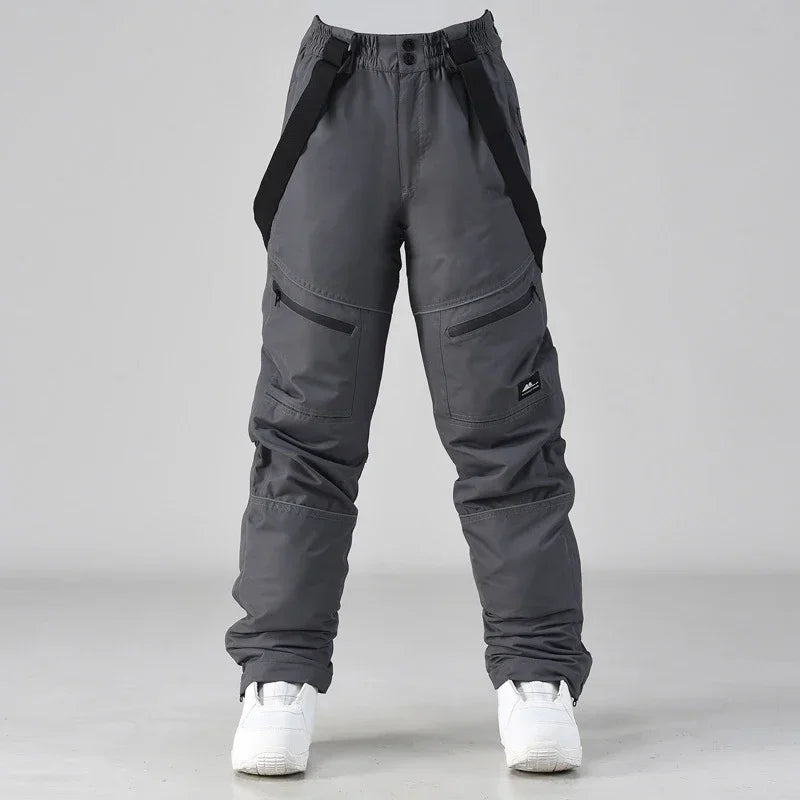 2024 deporte al aire libre hombre pantalones de esquí a prueba de viento mujeres pantalones de nieve montaña algodón Snowboard monos femeninos ropa impermeable