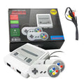 Consola retro blanca con mando cableado, caja del producto y accesorios