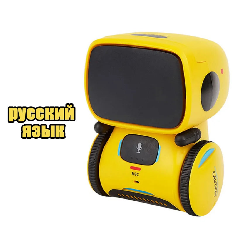 Robot de juguete amarillo con pantalla negra y ruedas, botón de grabación