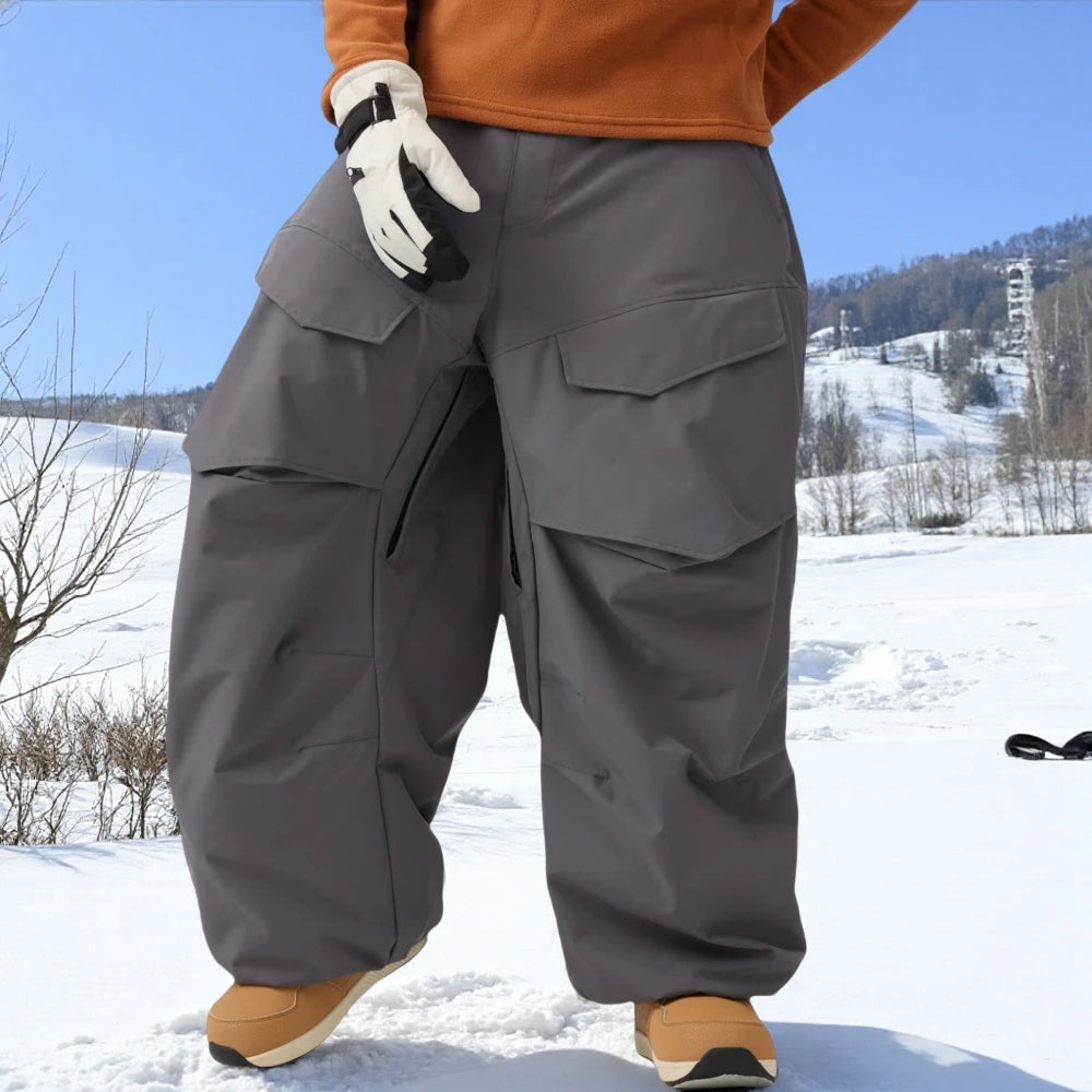Pantalones de esquí holgados resistentes al desgaste para hombre, pantalones de invierno con bolsillos sueltos aislados para mujer, ropa impermeable para deportes al aire libre, cálida 2025