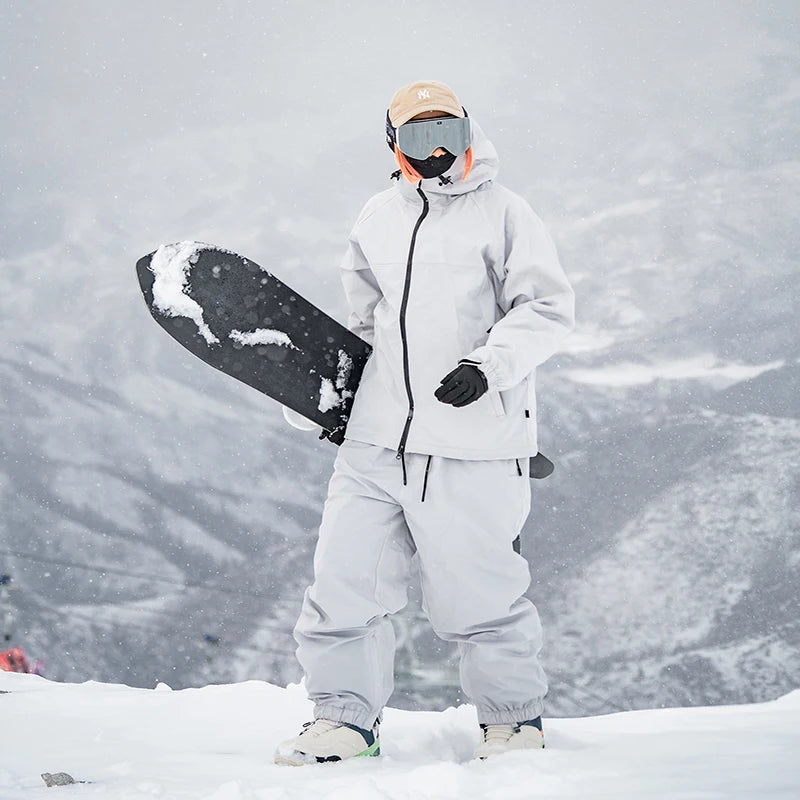 Nuevo traje de esquí de Color sólido para parejas de invierno, Snowboard para hombres, ropa deportiva informal impermeable a prueba de viento para mujeres, ropa deportiva cálida y transpirable