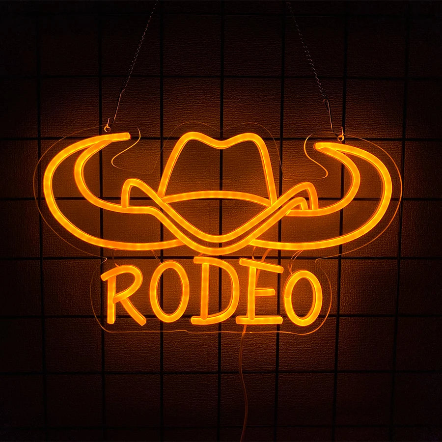 Señal LED de neón para pared con toro naranja y texto “RODEO” en letras grandes