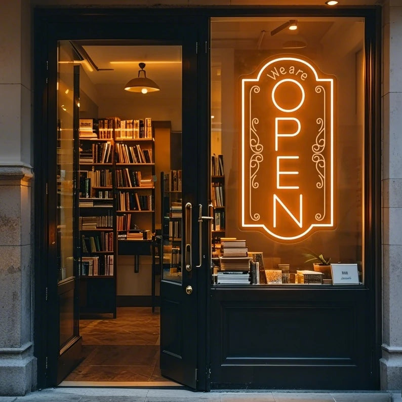 Letrero de neón LED «OPEN» con luz ámbar cálida y marco decorativo