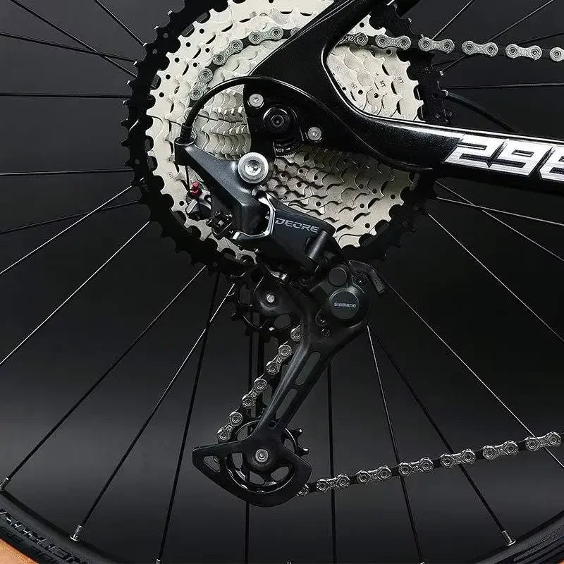 Bicicleta de montaña de 29 pulgadas con cuadro de fibra de carbono, horquilla de aleación de aluminio de alta calidad, 24 velocidades y frenos de disco hidráulicos comunes