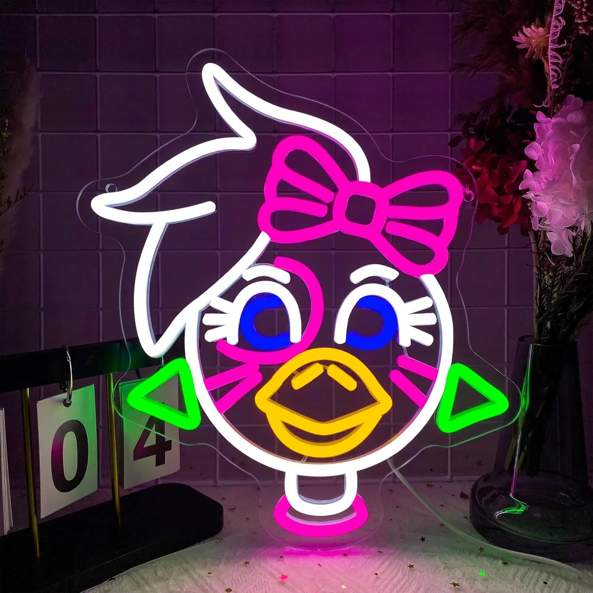 Letrero de neón de conejo anime con lazo rosa, ojos azules y contorno blanco.