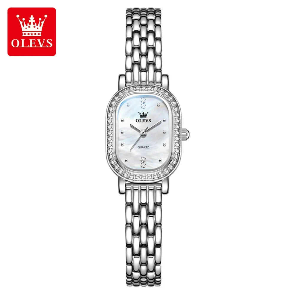 Reloj de pulsera para mujer OLEVS de lujo, diseño ovalado con bisel de cristal, cuarzo delgado, correa de piel y acero, elegante reloj multicolor 5697