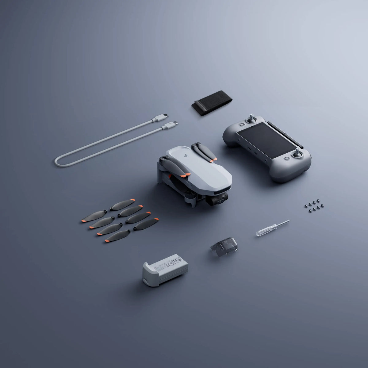 Drone y control remoto con baterías y hélices, vista superior del kit