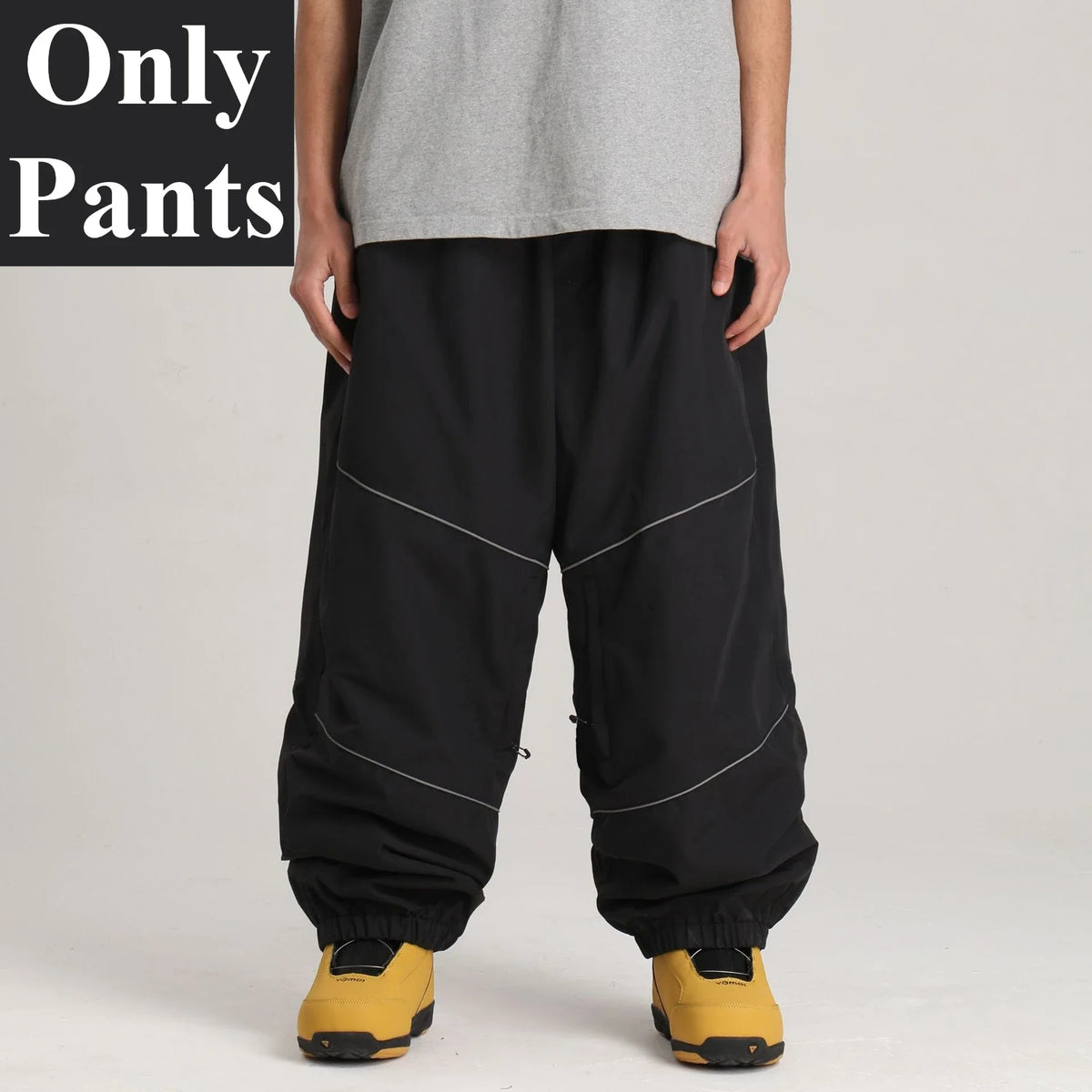 Pantalones de snowboard holgados para hombre GSOU SNOW, con diseño de bloques de color, impermeables, resistentes al viento, transpirables y con detalles reflectantes.