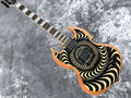 Nueva Guitarra Eléctrica Wylde Audio en Negro y Beige con Diseño Espiral Hipnótico, Acabado en Madera Natural, Dos Humbuckers EMG, Puente Fijo Negro