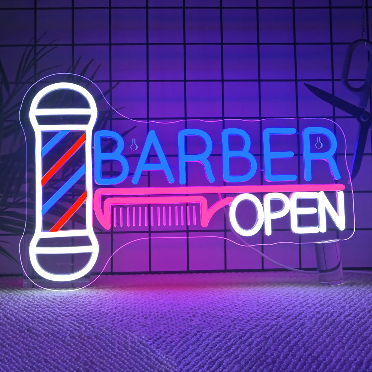 Rótulo de neón para barbería con «BARBER» y «OPEN», poste con rayas multicolor