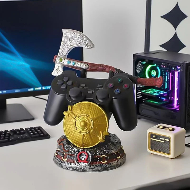 Soporte para mando con figura de escudo dorado, hacha plateada y control negro