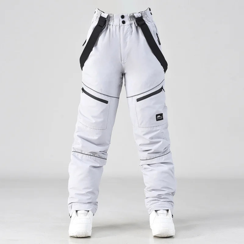 2024 deporte al aire libre hombre pantalones de esquí a prueba de viento mujeres pantalones de nieve montaña algodón Snowboard monos femeninos ropa impermeable