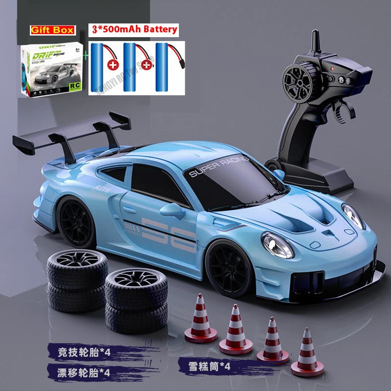 Coche RC de deriva 1:24 azul con control remoto, neumáticos y conos