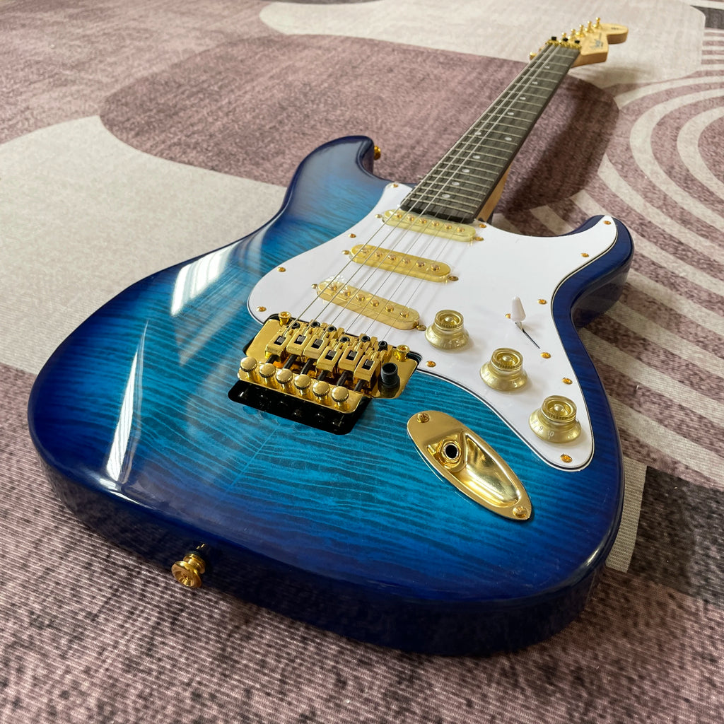 Guitarra Eléctrica Azul ST con Herrajes Dorados, Barra de Trémolo, Diapasón de Palisandro, Envío Rápido