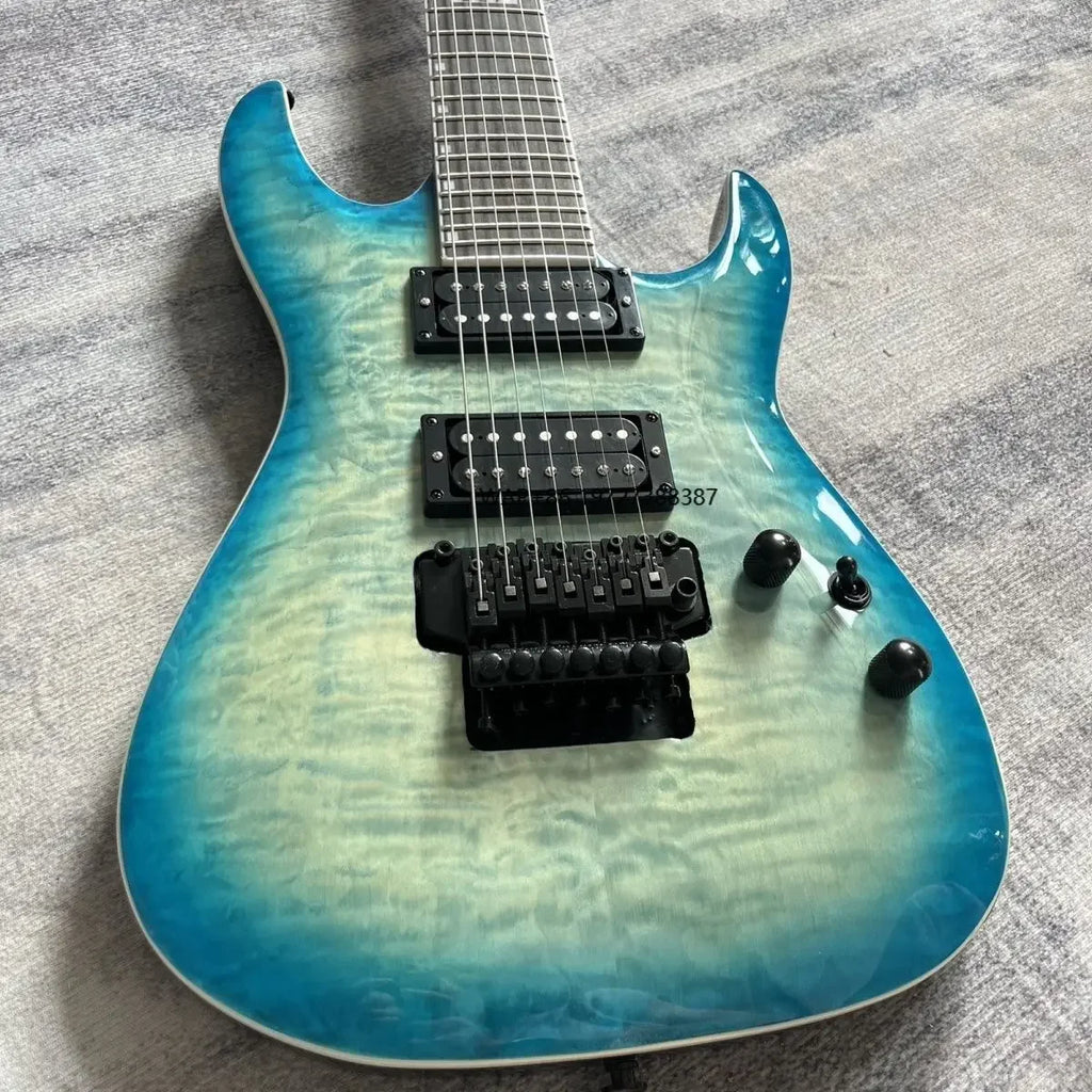 Guitarra eléctrica hecha a medida con cuerpo de caoba lacado en azul, mástil de arce y diapasón de palisandro