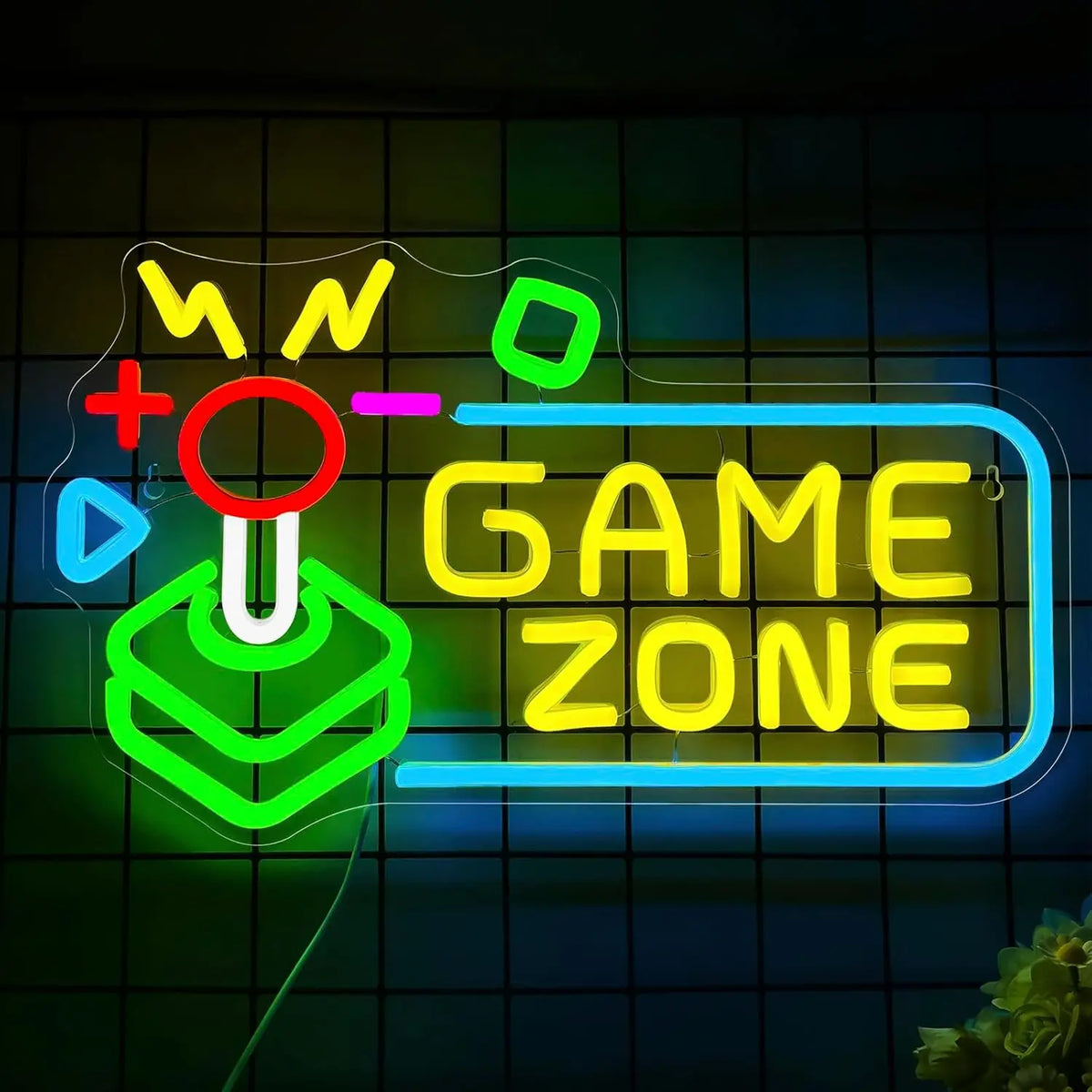 Letrero LED neón “GAME ZONE” con iconos y flechas, colores verde, azul, amarillo y rosa.