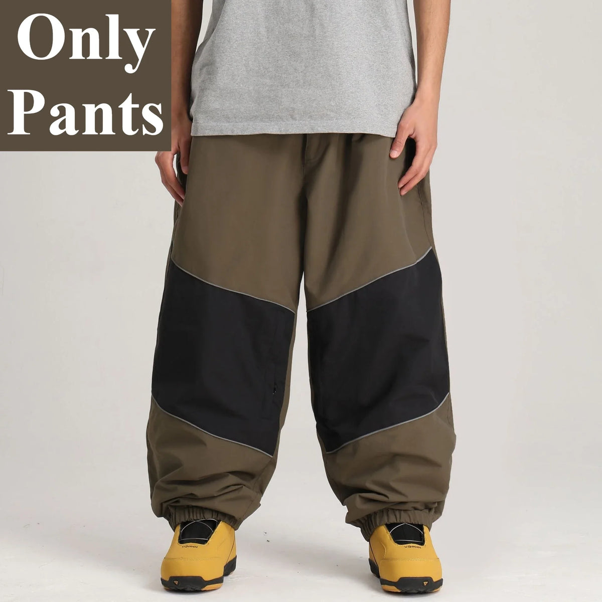 Pantalones de snowboard holgados para hombre GSOU SNOW, con diseño de bloques de color, impermeables, resistentes al viento, transpirables y con detalles reflectantes.