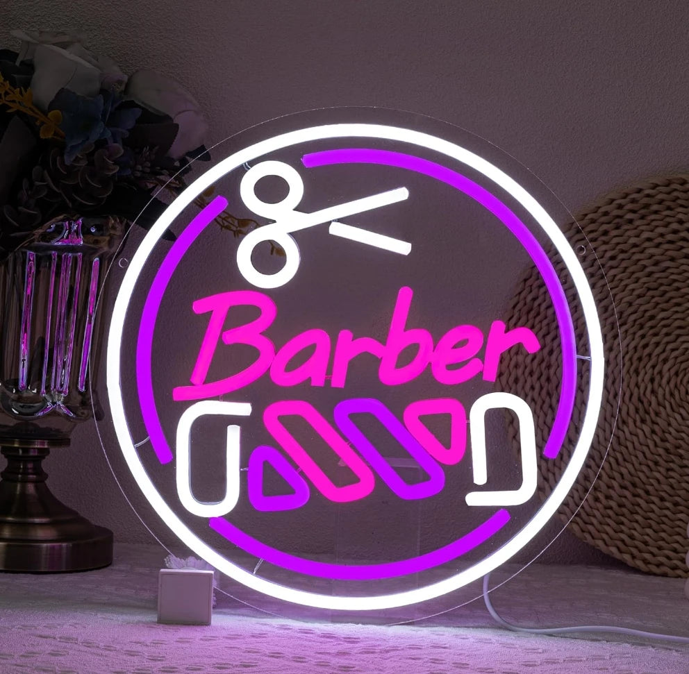 Rótulo de neón circular «Barber» con herramientas, contorno blanco y rosa