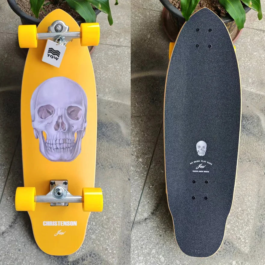 Patineta de surf YOW Land, modelo CHRISTENSON, diseño de calavera naranja, 34 pulgadas, con laterales curvos dobles, calidad profesional.