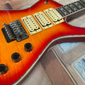 Guitarra eléctrica de 6 cuerdas con tapa de arce tigrado efecto sunset, sistema de trémolo, pastillas HHH, guitarra eléctrica de rock metálico.