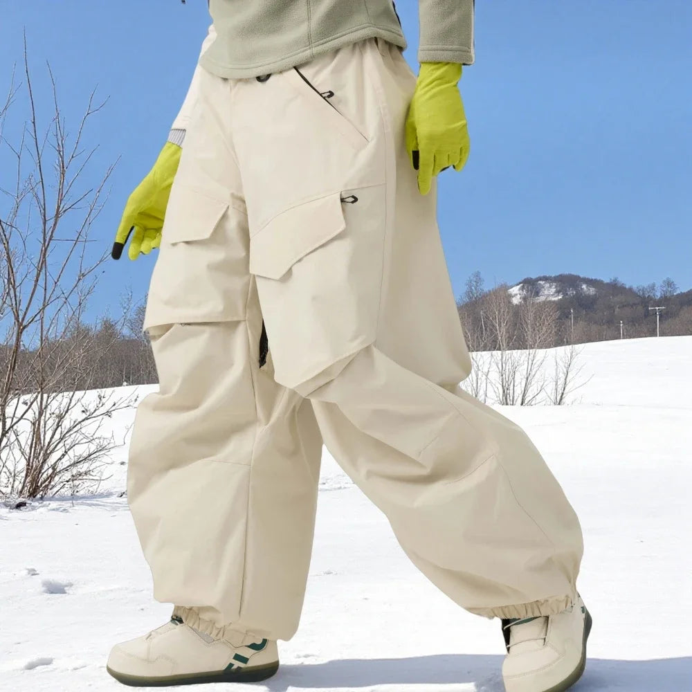 Pantalones de esquí holgados resistentes al desgaste para hombre, pantalones de invierno con bolsillos sueltos aislados para mujer, ropa impermeable para deportes al aire libre, cálida 2025