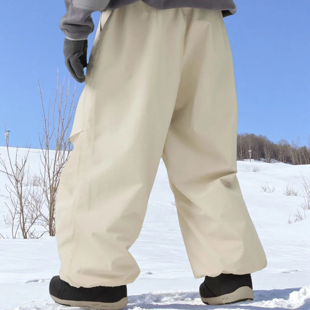 Pantalones de esquí holgados resistentes al desgaste para hombre, pantalones de invierno con bolsillos sueltos aislados para mujer, ropa impermeable para deportes al aire libre, cálida 2025